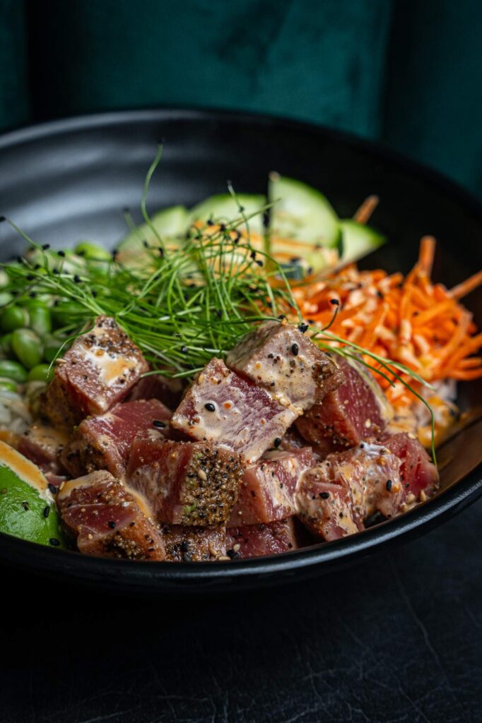 Ahi Poke Bowl with shredded carrots cucumbers green onions ponzu